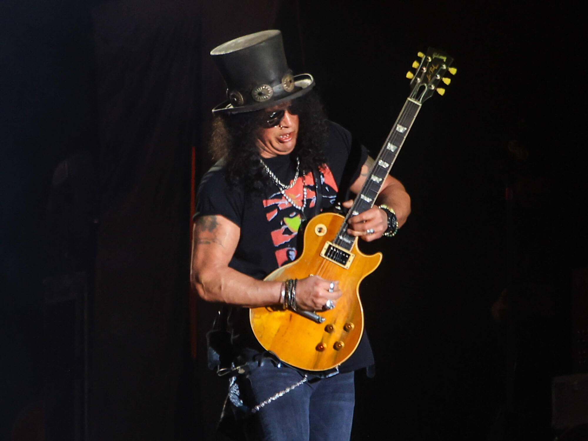 Slash performing onstage